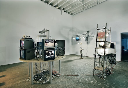 Jon Kessler, 2000 FCA grantee, installation view of FCA-supported solo exhibition <em>Global Village Idiot</em>, New York, at Deitch Projects, 2004. Courtesy the artist. 