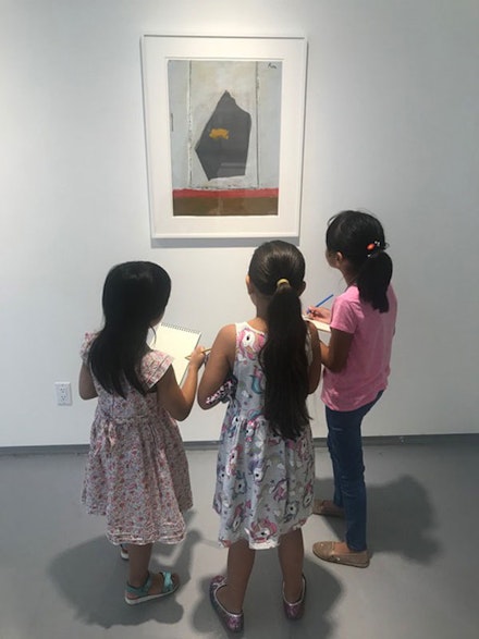 Students view a collage by Robert Motherwell at the Dedalus Foundation's 2019 Summer Arts Camp.
