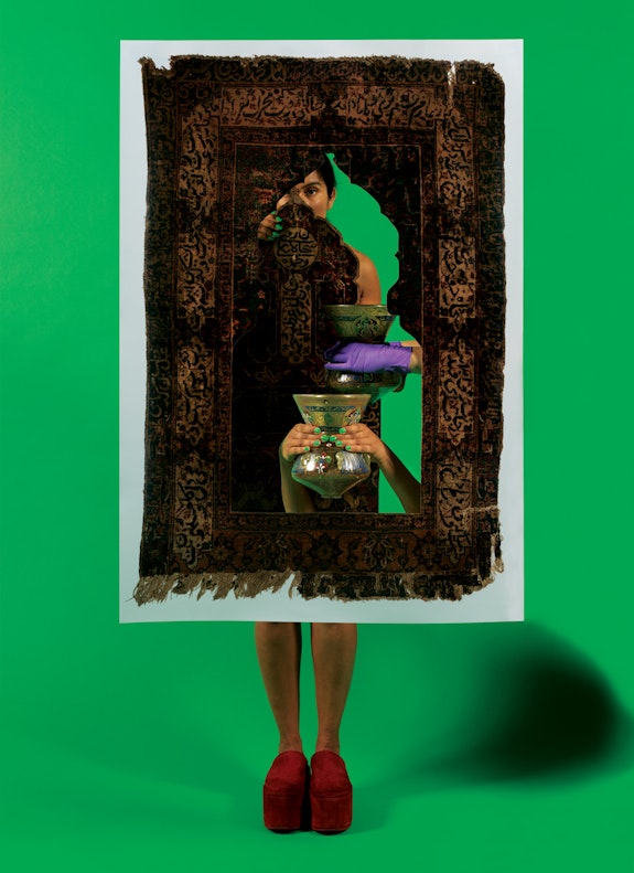 Baseera Khan, <em>Mosque Lamp and Prayer Carpet Green from Law of Antiquities</em>, 2021. Archival inkjet print, artist’s custom frame, 33 × 24 in. (83.82 × 60.96 cm). Courtesy of the artist and Simone Subal Gallery, New York. © Baseera Khan. 