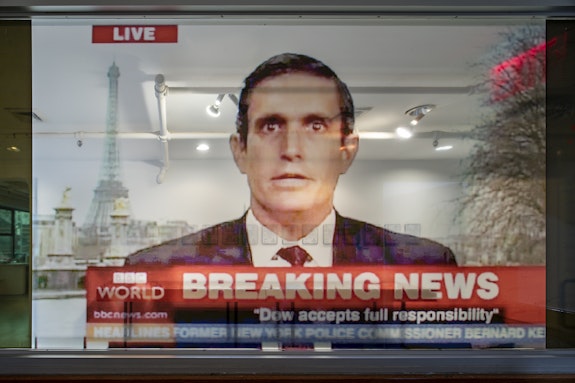 Yes Men, <em>Dow Does the Right Thing</em>, Hallway window, still from BBC World News appearance, 2004. Clear vinyl, 51.5 x 97 inches.