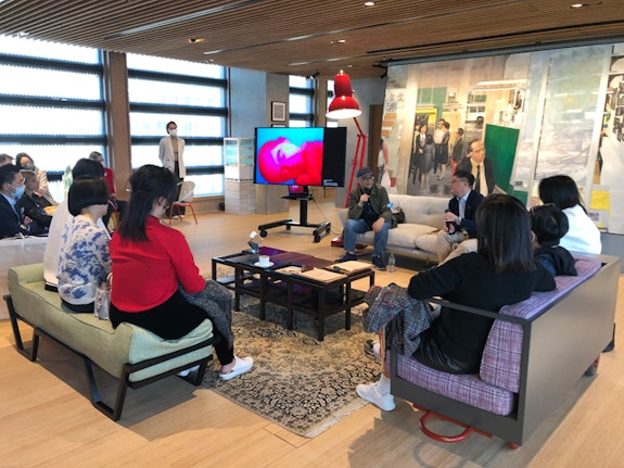 Zhang Xiaogang talks to museum patrons in the M+ Lounge. Courtesy the author.