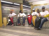 The United Drummers of Yisrael (UDY) performing on the subway platform.