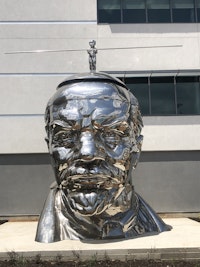 Gao Brothers, <em>Miss Mao Trying to Poise Herself on Top of Lenin’s Head</em>, 2009. Stainless steel. Photo: Ethel Shipton.