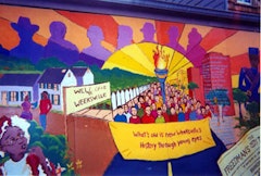 A mural painted by local school kids hangs outside the site of Weeksville. Photos by Kevin Plumberg