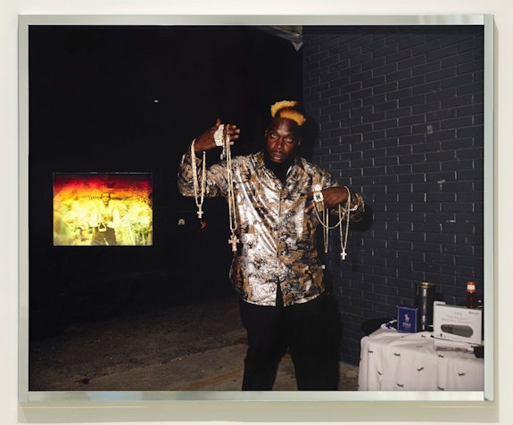 Deana Lawson, <em>Black Gold (“Earth turns to gold, in the hands of the wise,” Rumi)</em>, 2021. Pigment print with embedded hologram. Courtesy the artist; Sikkema Jenkins & Co., New York; and David Kordansky Gallery, Los Angeles. © Deana Lawson.