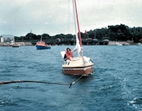 Bas Jan Ader in “Ocean Wave,” being towed seaward to begin his transatlantic voyage from Cape Cod, Massachusetts, July 1975. Photo courtesy Mary Sue Anderson-Ader. 