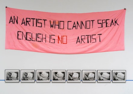Mladen Stilinović, <em>An Artist Who Cannot Speak English Is No Artist</em>, 1992. Acrylic on artificial silk, 55 × 165 inches. Museo Reina Sofía, Madrid. Photo: ruelleruelle / Alamy Stock Photo. 