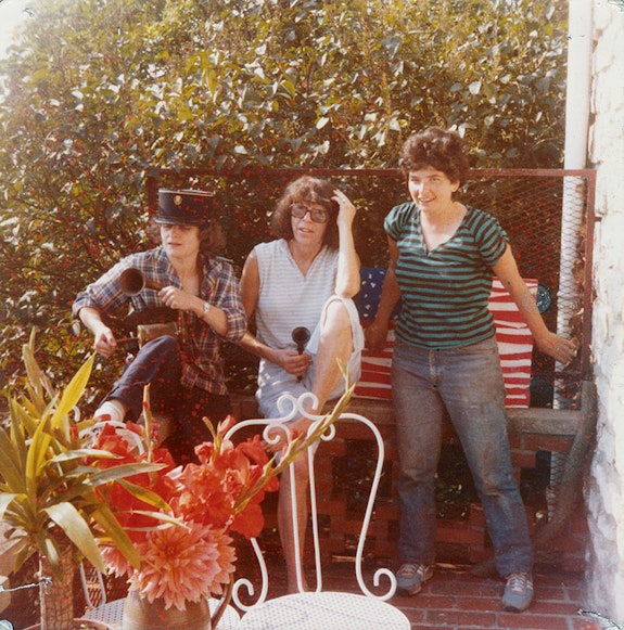 Gisèle Barreau, Joan Mitchell, and Joyce Pensato celebrating the July 4 holiday on the terrace of Mitchell's home in Vétheuil, 1980. Estate of Joyce Pensato.