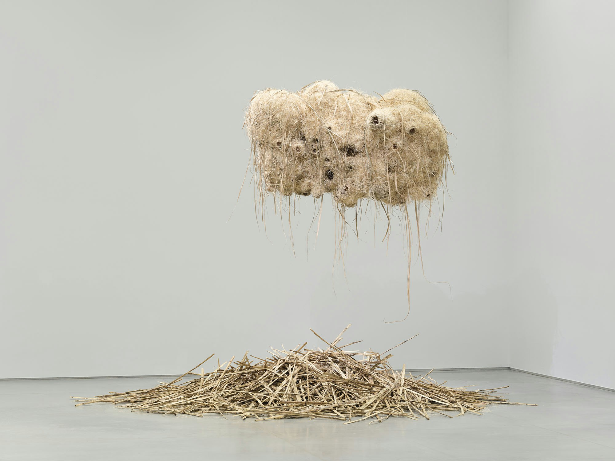 Andrea Chung, <em>House of the Historians</em>, 2022. Sugarcane bark and leaves, sweetgrass, excelsior and floral twine, dimensions variable. Courtesy Ford Foundation Gallery. Photo: Sebastian Bach.