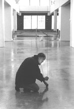 Fred Sandback installing his work at Dia:Beacon in February 2003. Photo by Nic Tenwiggenhorn. Courtesy Dia Art Foundation.