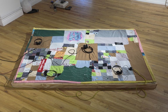 pear ware, <em>Quilt, </em>2022. Joan’s t-shirts, cotton, silk, buttons, patches, embroidery, thread. Courtesy the artists and Hercules Art/Studio Program.