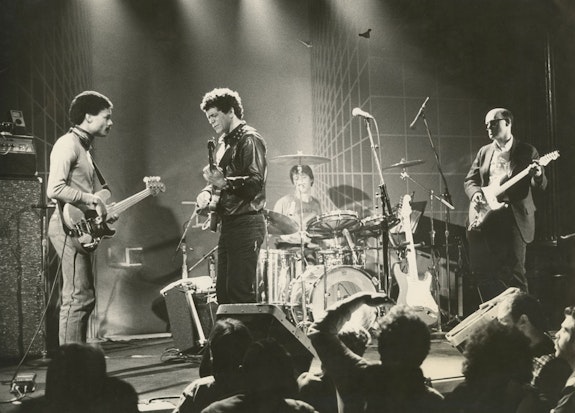 Lou Reed and band performing at The Bottom Line in New York City as part of the Legendary Hearts US Tour, 1983. Robert Quine, guitar; Fernando Saunders, bass; and Fred Maher, drums. © Jane L. Wechsler. Lou Reed Papers, Music & Recorded Sound Division, The New York Public Library for the Performing Arts.