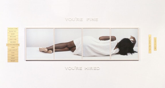 Lorna Simpson, <em>You're Fine, </em>1988. 4 dye diffusion color Polaroid prints, 15 engraved plastic plaques, ceramic letters, unique, overall: 39 x 108 1/8 x 1 5/8 inches. © Lorna Simpson. Courtesy the artist and Hauser & Wirth. Private Collection.