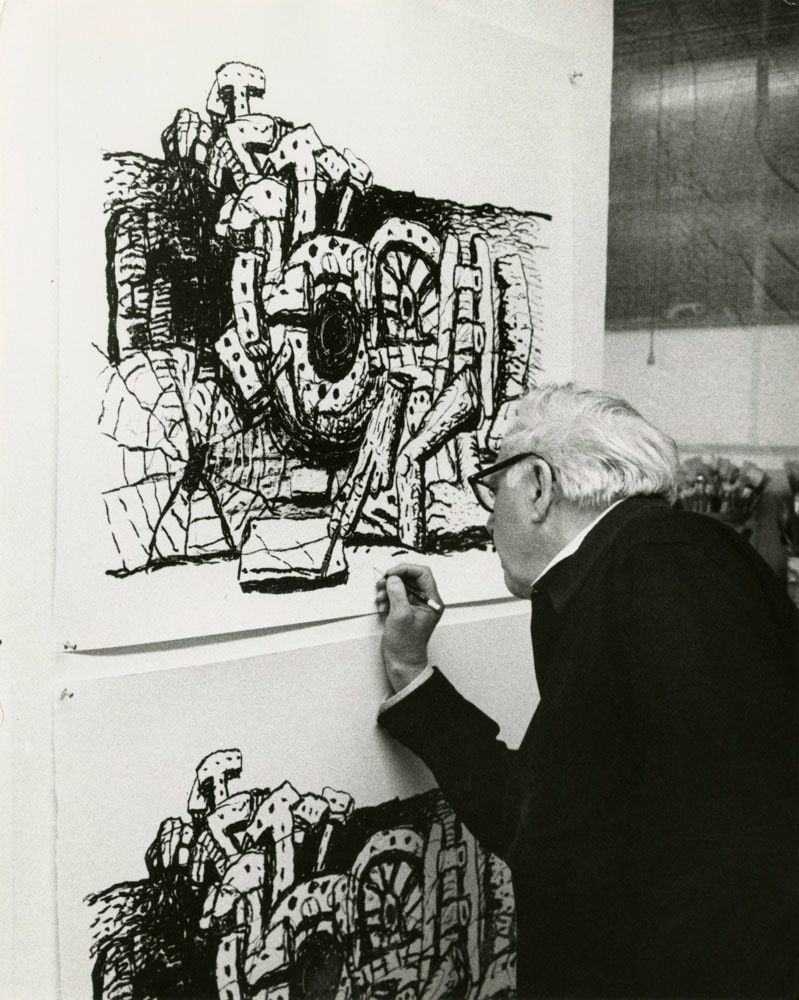 Guston signing Gemini G.E.L. Lithographs in his studio, 1979. Photo: Sidney Felsen