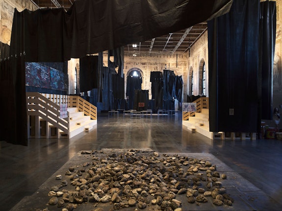 Installation view: <em>Oscar Murillo, A Storm Is Blowing From Paradise</em>, Scuola Grande della Misericordia, Venice, 2022. Reinis Lismanis, Dominique Russell © Oscar Murillo, courtesy the artist. Photo: Tim Bowditch.