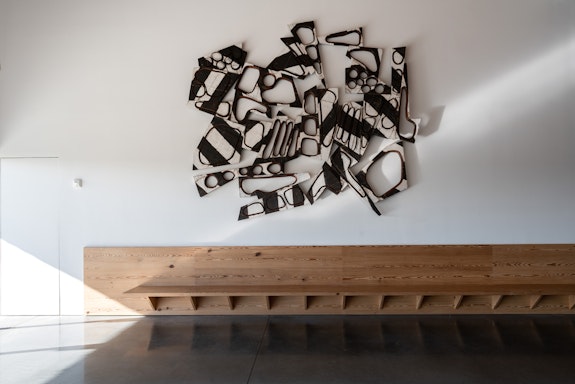 Mel Kendrick, <em>Thinking of What, </em>2022. Ebonized mahogany and gesso, 119 x 140 4 ½ inches. Courtesy the artist and David Nolan Gallery. Photo: Gary Mamay.