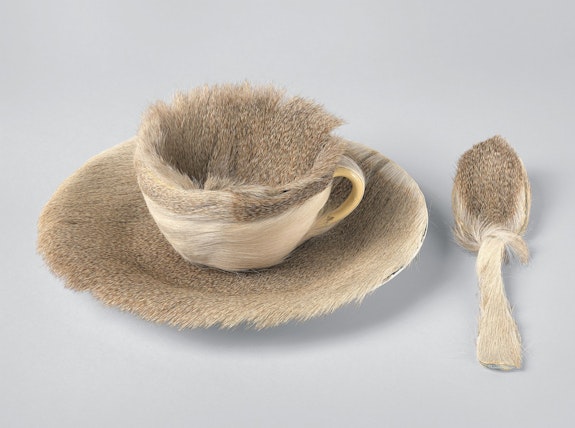 Meret Oppenheim, <em>Object (Objet)</em>, 1936. Fur-covered cup, saucer, and spoon, cup 4 3/8 inches diameter; saucer 9 3/8 inches in diameter; spoon 8 inches long, overall height 2 7/8 inches. The Museum of Modern Art, New York.