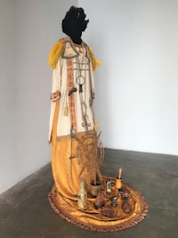 Lezley Saar, <em>Reuel is a shaman and spiritual healer.....a living personification of the head-on collision of Catholic and African religions.</em>, 2019. Fabric, objects, polyester fiber-fill, mixed media, 80 x 40 x 46 inches. Courtesy the artist and Walter Maciel Gallery.