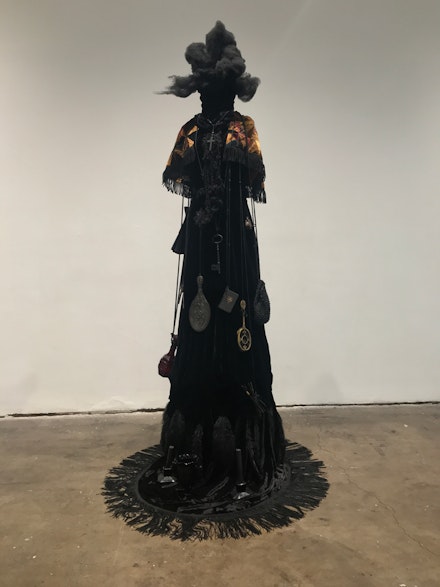 Lezley Saar, <em>Mourna is the mother of the deceased, whom she keeps in the dark depths of the earth. She protects all their secrets and memories, swaying to faint music, making the ground slippery with her tears</em>., 2019. Fabric, glass objects, polyester fiber-fill, mixed media, 85 x 40 x 48 inches. Courtesy the artist and Walter Maciel Gallery.