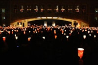 February 18, 2008 - Thousands gather on the mall under Torgerson Bridge to remember students lost in the shootings at NIU the week before. <i>Photo by Kevin Cupp. </i>