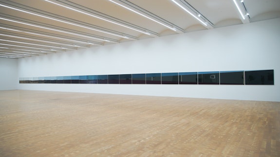 R.H. Quaytman, <em>Morning, Chapter 30</em>, 2016. Gouache, varnish, oil, lacquer, silkscreen ink, gesso on wood. 37 x 60 inches, 22 panels, each 24 3⁄4 x 40 inches. Courtesy the artist and Glenstone, MD. © R.H. Quaytman. Photo: Ron Amstutz. 