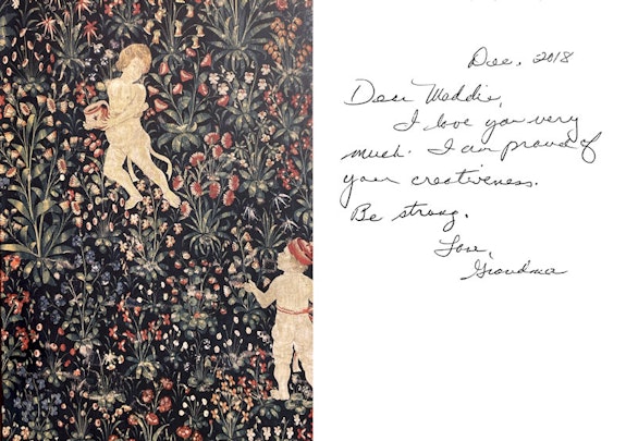 Madeline Gilmore, photo of postcard from Museum of Fine Arts Boston showing <em>Mille Fleurs with Putti </em>(detail), ca. 1600. Wool and silk tapestry. Courtesy the author. 
