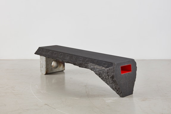 Samuel Ross, <em>FIRE OPENS STONE</em>, 2022. Nero Africa granite, glass fiber reinforced concrete, fired OSB, fired honey and milk patina, painted steel, polyurethane, 18 x 73.75 x 19.75 inches. Courtesy of Friedman Benda and Samuel Ross. Photo: Timothy Doyon.