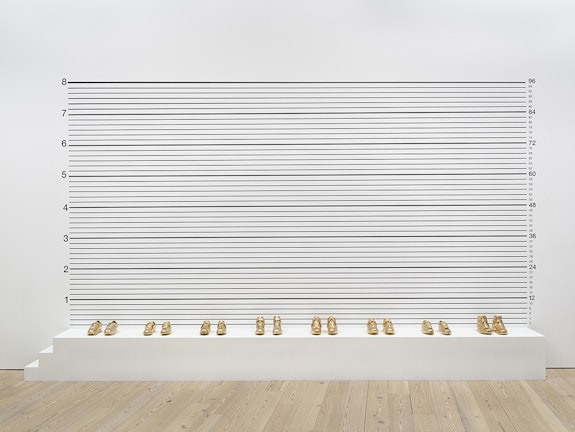 Gary Simmons, <em>Lineup</em>, 1993. Screenprint with gold-plated basketball shoes, 114 × 216 × 18 inches. Whitney Museum of American Art, New York; purchase with funds from the Brown Foundation, Inc. Courtesy Hauser & Wirth. © Gary Simmons. Photo: Ron Amstutz