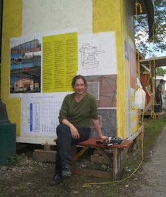 Butler outside her 4' x5' studio shack at Simon Draper's 