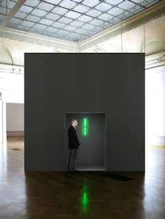 Alfredo Jaar, The Sound of Silence, (2006). Installation with wood, aluminum, fluorescent lights, strobe lights and video projection. Duration of projection: 8 minutes. Software design by Ravi Rajan. Installation view at Musée Cantonal des Beaux-Arts Lausanne, Switzerland, (2007) Courtesy of the artist and Galerie Lelong.
