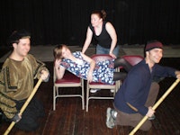 Shakespeare in ACTion (left to right: Joshua Levine, Natalie Kuhn recumbent, Kristy Dodson and Scott Barrow) during a performance in which the director was brought up during an audience participation section. Photo by Amy Sabin. 