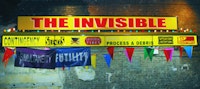 Ester Partegàs, “The Invisible” (2008). Aluminum and Plexiglas awning, bulbs, fluorescent lights, vinyl, banners, pennants. 20 ft × 14 ft × 2 ft 5 in.
Commissioned by the Aldrich Museum, Ridgefield, CT. Courtesy of the artist and Foxy Production, New York. Installation at Brooklyn Academy of Music,
Photo by Shervin Lainez.
