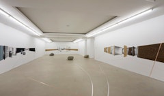 Tatiana Trouvé Envelopments, 2010 Mixed media installation comprising three wall drawings in graphite and charcoal with collage, floor drawings in pure copper and aluminum tape and one rock, partially lacquered Dimensions variable Copyright Tatiana Trouvé, Courtesy Gagosian Gallery, Photograph by Robert McKeever.
