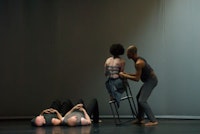 Liz Lerman Dance Exchange in The Matter of Origins.. Photo by George Hagegeorge. Sarah on chair.