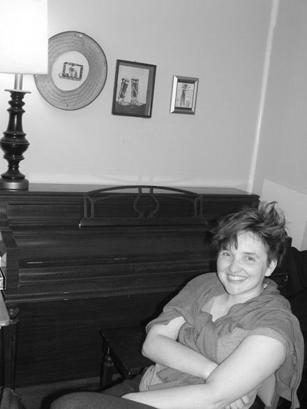 At home with her piano: Cynthia Hopkins. Photo by Michelle Memran.