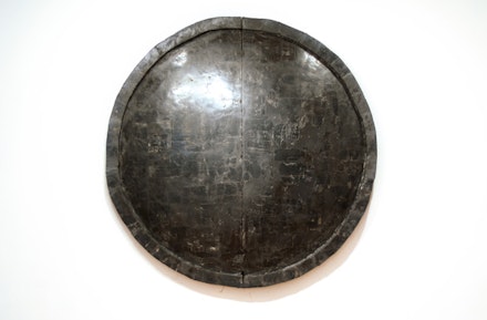 Alejandra Prieto, “Concave Coal Mirror.” Coal. 72” diameter. Courtesy Y Gallery.