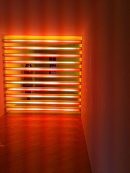 Dan Flavin, “untitled (to Robert, Joe and Michael),” 1975–81. Pink and yellow fluorescent light. Installed in a corridor 8 x 8’. Edition 2/3. Photo: Greg Lindquist. Courtesy the Estate of Dan Flavin.